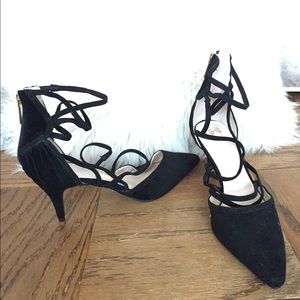 Black suede heels with lace up detail. Never worn.
